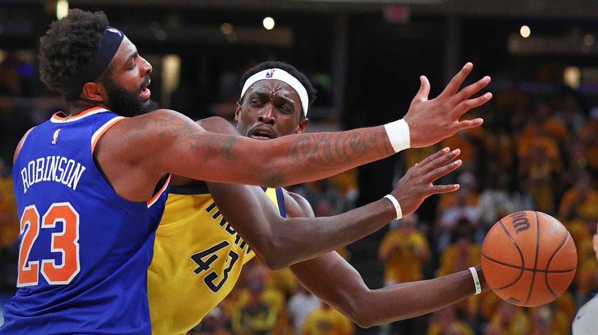 New York Knicks center Mitchell Robinson (23) defends Indiana Pacers forward Pascal Siakam (43) in the second quarter during game six of the eastern conference finals for the 2025 NBA Playoffs at Gainbridge Fieldhouse.