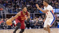 Detroit Pistons forward Ronald Holland II (5) defends against Cleveland Cavaliers guard Donovan Mitchell (45) during the second half at Little Caesars Arena.