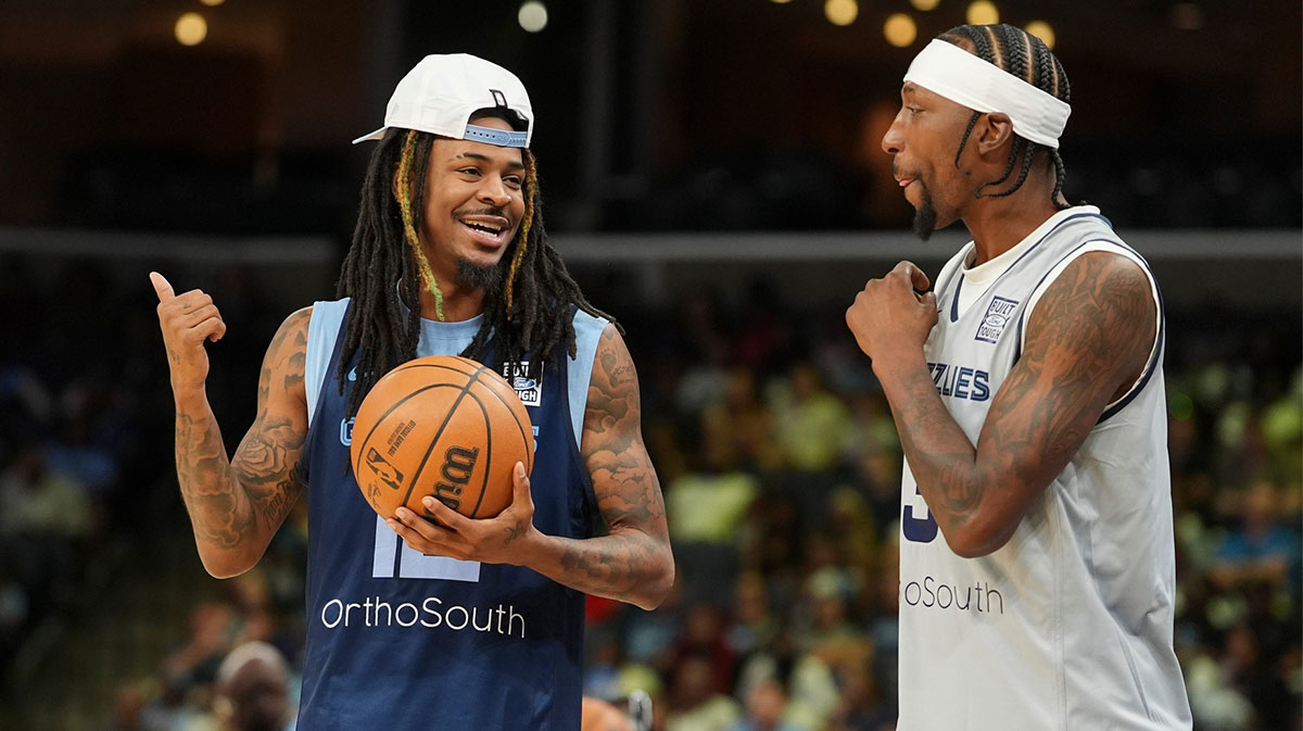 Grizzlies' Ja Morant (12) and Kentavious Caldwell-Pope (3) talk during open practice at the FedExForum on October 4, 2025, in Memphis, Tenn.