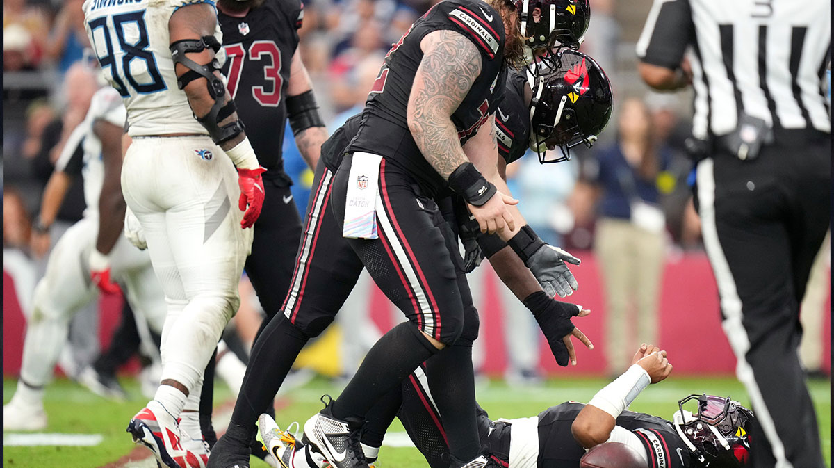 Arizona Cardinals quarterback Kyler Murray (1) is helped off the ground after being sacked by the Tennessee Titans at State Farm Stadium in Glendale on Oct. 5, 2025.
