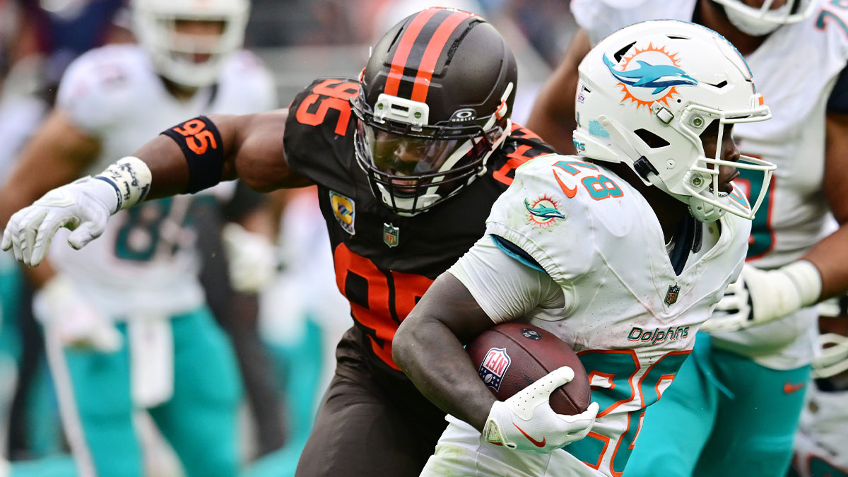 Cleveland Browns defensive end Myles Garrett (95) chases Miami Dolphins running back De'Von Achane (28) during the second half at Huntington Bank Field.
