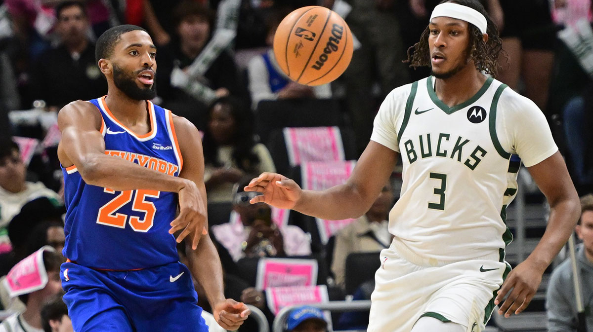 New York Knicks guard Mikal Bridges (25) knocks the ball away from Milwaukee Bucks center Myles Turner (3) in the first quarter at Fiserv Forum.