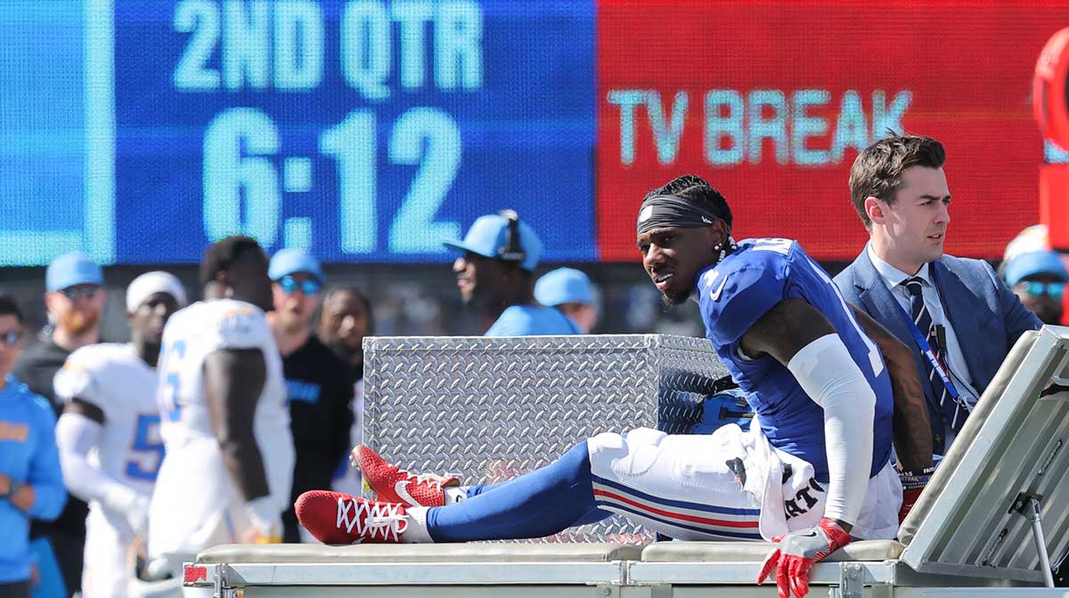 New York Giants wide receiver Malik Nabers (1) is carted off the field following an injury during the second quarter against the Los Angeles Chargers at MetLife Stadium.