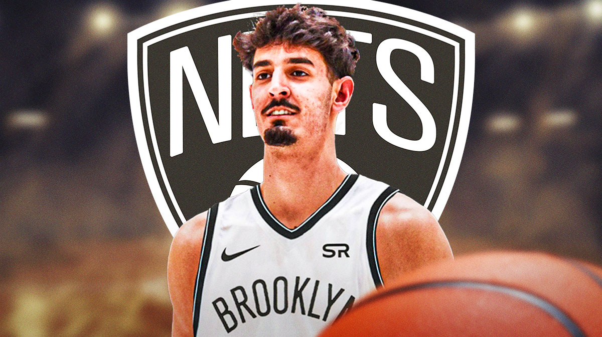 Ben Saraf in a Nets uniform with a Nets logo next to him