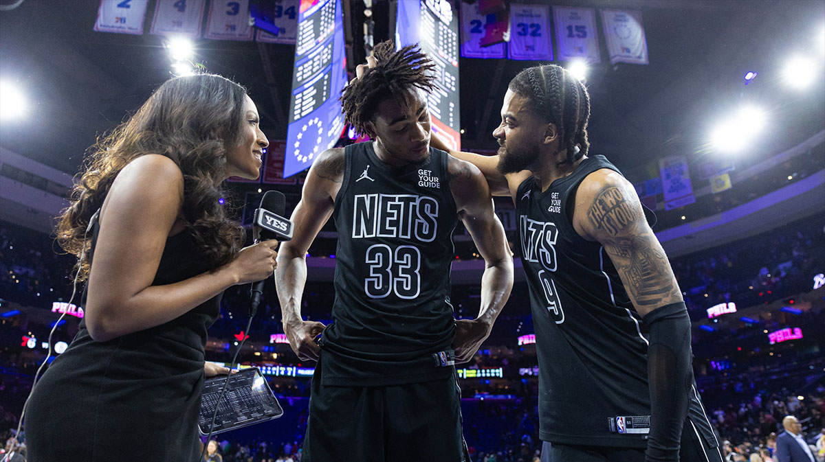 Brooklyn Nets center Nic Claxton (33) celebrates with forward Trendon Watford (9) while being interviewed after his game winning shot against the Philadelphia 76ers at Wells Fargo Center.