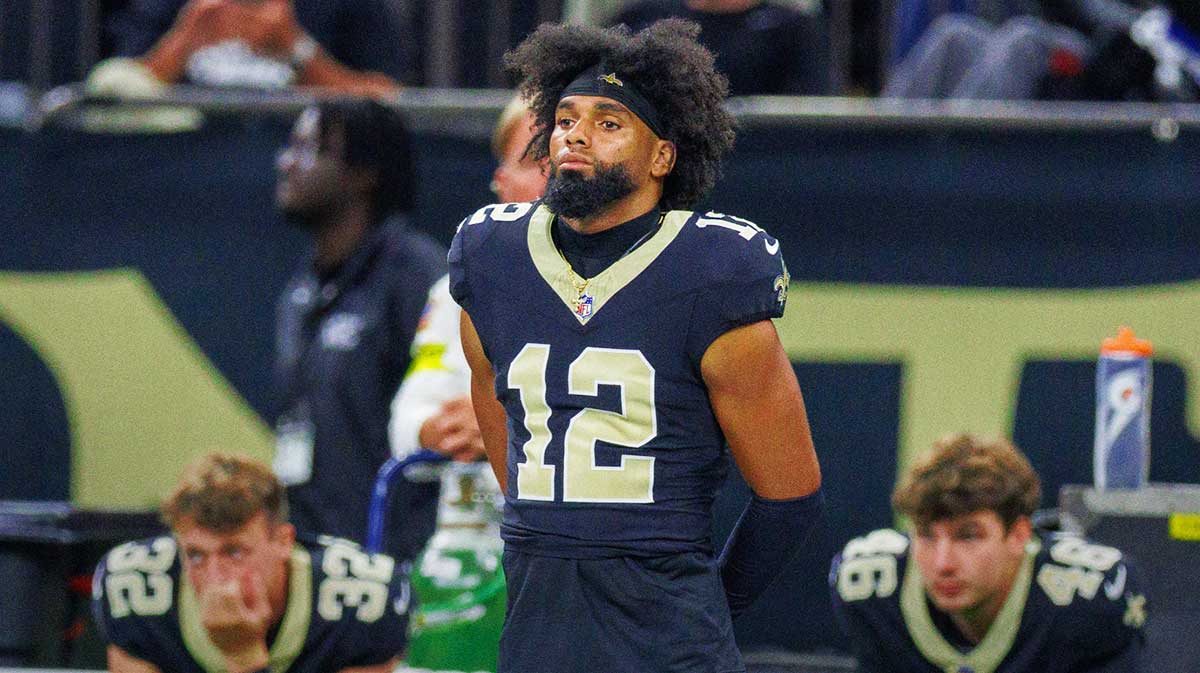 New Orleans Saints wide receiver Chris Olave (12) and punter Kai Kroeger (32) and punter James Burnip (46) looks on against the Jacksonville Jaguars during the first half at Caesars Superdome.