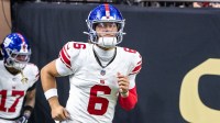 New York Giants quarterback Jaxson Dart (6) runs out the tunnel against New Orleans Saints during warmups at Caesars Superdome.
