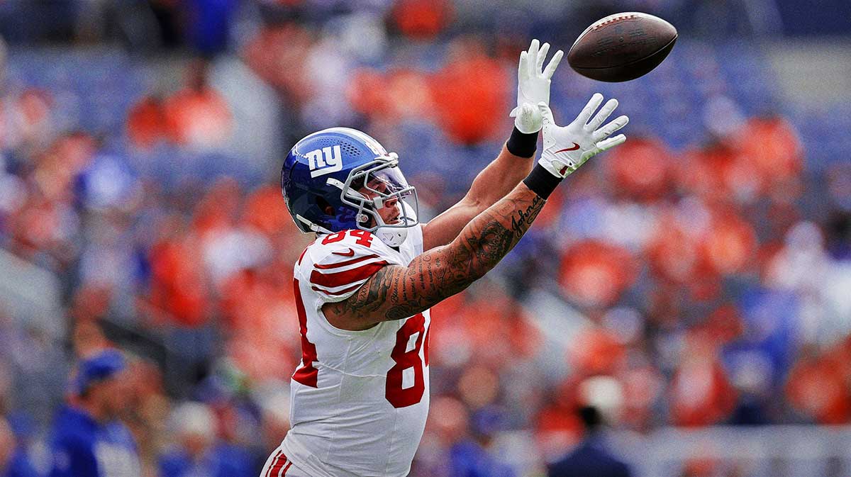 New York Giants tight end Theo Johnson (84) warms up before the game against the Denver Broncos