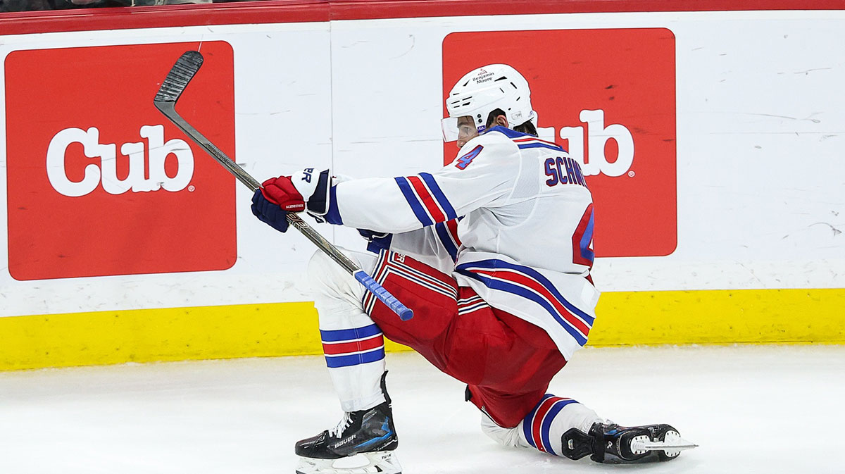 New York Rangers defenseman Braden Schneider (4) celebrates his game winning goal against the Minnesota Wild during overtime at Xcel Energy Center.