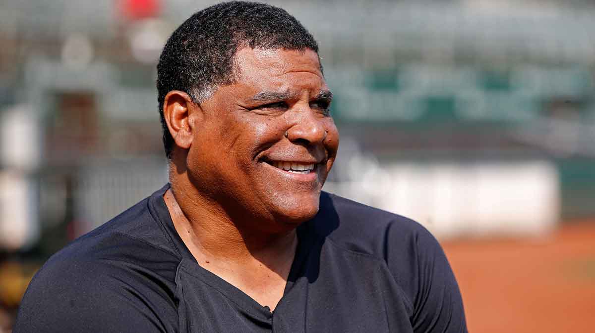 New York Yankees bullpen coach Mike Harkey (60) is interviewed on the field before the game against the Oakland Athletics at RingCentral Coliseum.