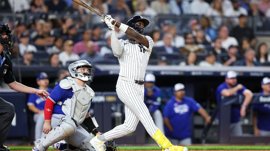 New York Yankees second baseman Jazz Chisholm Jr. (13) hits a solo home run in the fifth inning against the Toronto Blue Jays during game three of the ALDS round for the 2025 MLB playoffs at Yankee Stadium.
