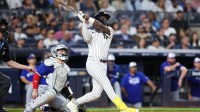 New York Yankees second baseman Jazz Chisholm Jr. (13) hits a solo home run in the fifth inning against the Toronto Blue Jays during game three of the ALDS round for the 2025 MLB playoffs at Yankee Stadium.