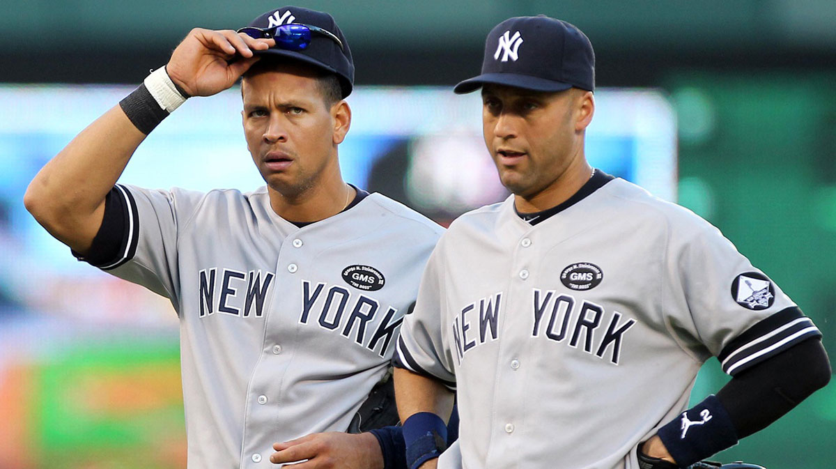 New York Yankees third baseman Alex Rodriguez (left) and shortstop Derek Jeter wait during a pitching change during the seventh inning of game two of the 2010 ALCS against the Texas Rangers at Rangers Ballpark.