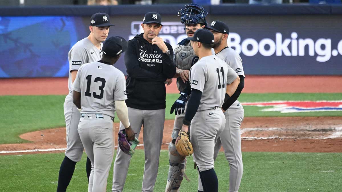 New York Yankees manager Aaron Boone (17) talks to players in the seventh inning against the Toronto Blue Jays during game one of the ALDS round for the 2025 MLB playoffs at Rogers Centre.