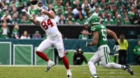 New York Giants tight end Theo Johnson (84) makes a catch against Philadelphia Eagles linebacker Zack Baun (53) in the third quarter at Lincoln Financial Field.