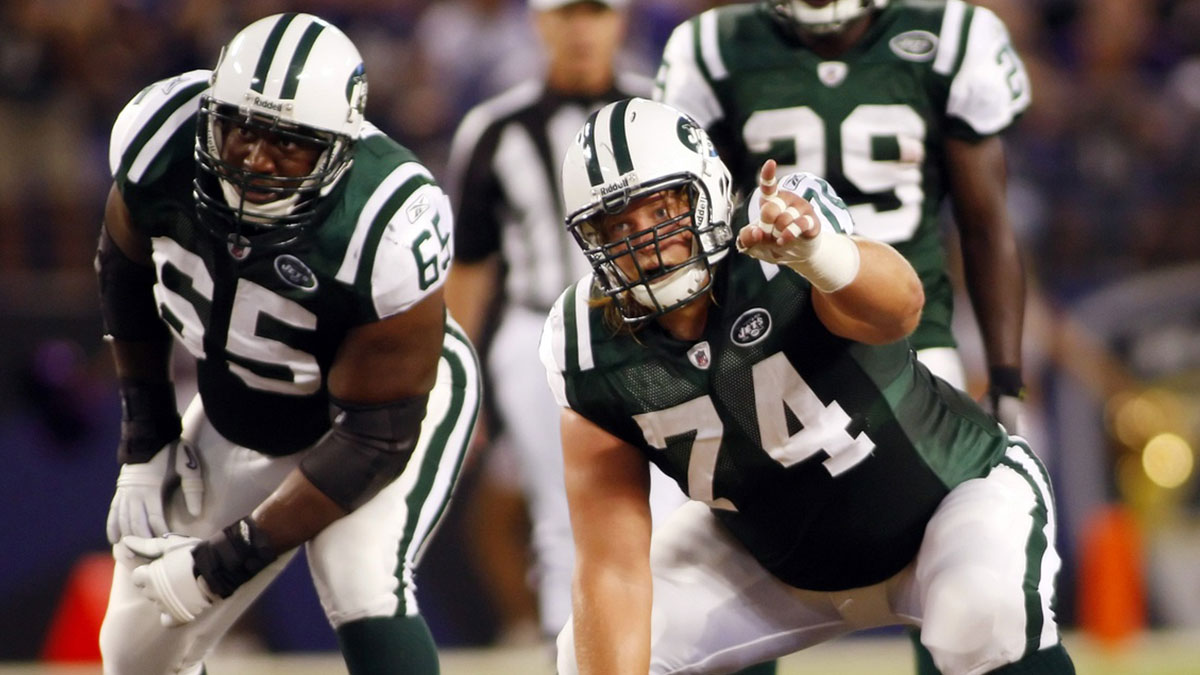 New York Jets center Nick Mangold (74) signals as guard Damian Woody (65) watches against the Baltimore Ravens in the second quarter at M&T Bank Stadium. The Ravens won 24-23.