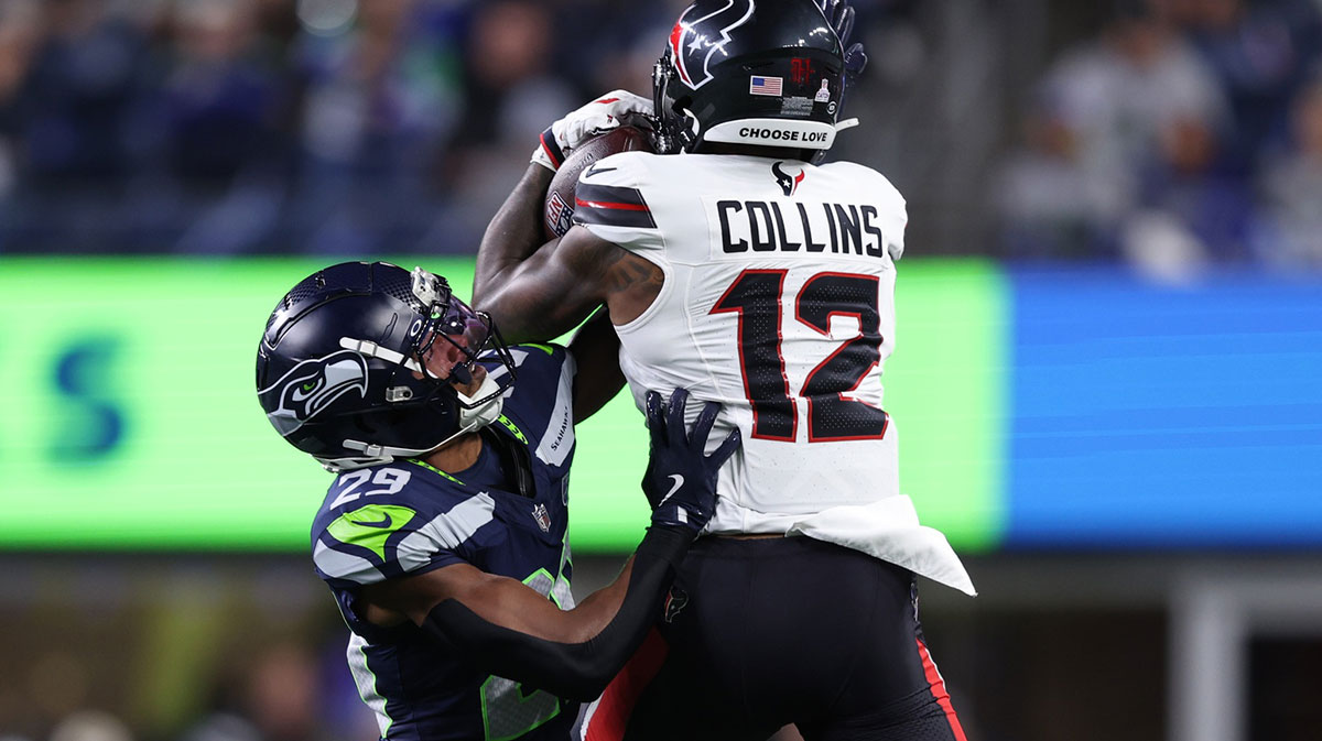 Houston Texans wide receiver Nico Collins (12) catches a pass against Seattle Seahawks cornerback Josh Jobe (29) during the second quarter at Lumen Field.