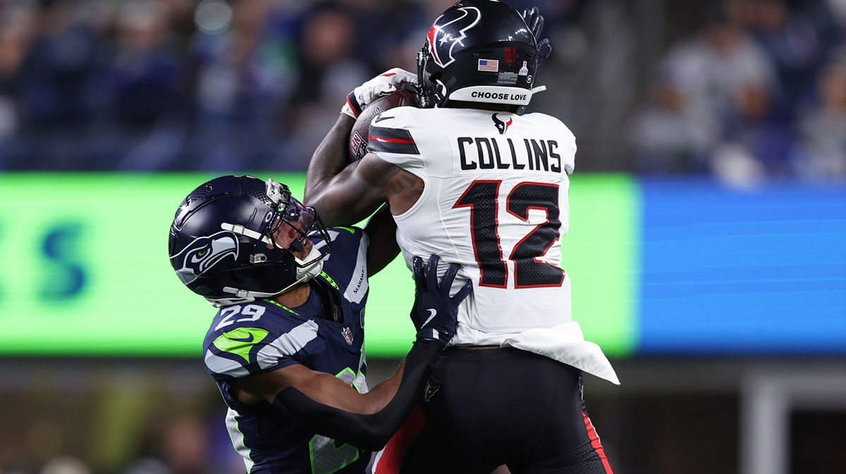 Houston Texans wide receiver Nico Collins (12) catches a pass against Seattle Seahawks cornerback Josh Jobe (29) during the second quarter at Lumen Field.