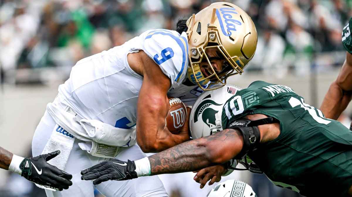 Michigan State's Wayne Matthews III, right, tackles UCLA's Nico Iamaleava during the second quarter on Saturday, Oct. 11, 2025, at Spartan Stadium in East Lansing.