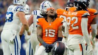 Denver Broncos linebacker Nik Bonitto (15) reacts after a missed field goal by Indianapolis Colts place kicker Spencer Shrader (3) on Sunday, Sept. 14, 2025, during a game at Lucas Oil Stadium in Indianapolis. A penalty on the Broncos game Shrader a second attempt which he made to win the game.
