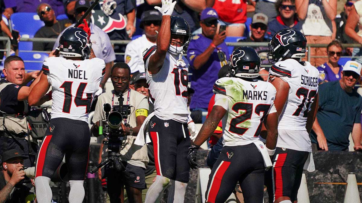 Houston Texans wide receiver Xavier Hutchinson (19) celebrates a touchdown with wide receiver Jaylin Noel (14), running back Woody Marks (27) and center Juice Scruggs (70) during the second quarter at M&T Bank Stadium.