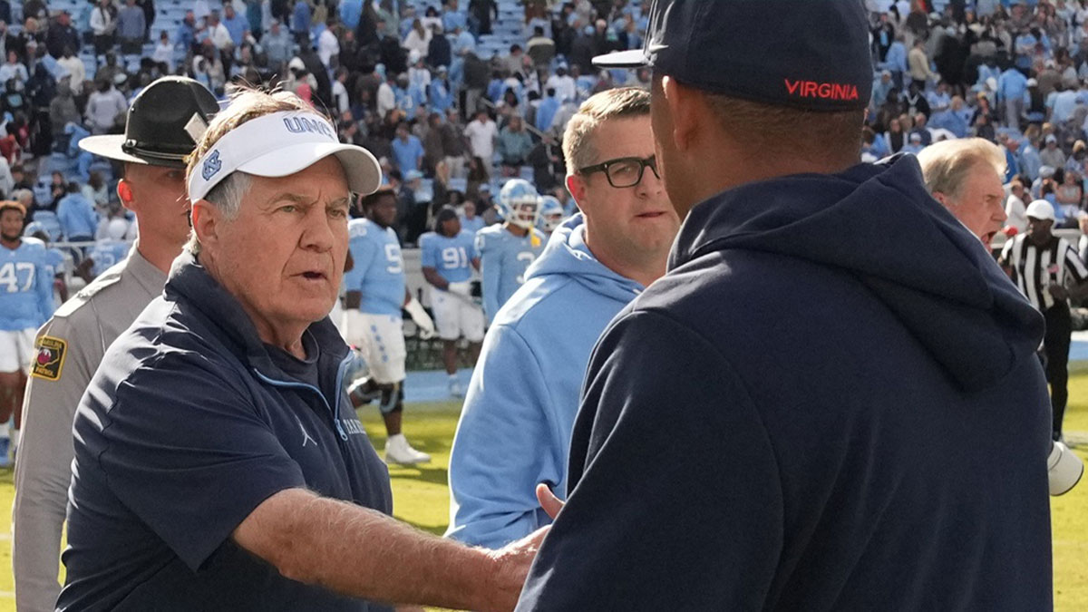 North Carolina Tar Heels head coach Bill Belichick shakes Virginia Cavaliers head coach Tony Elliott hand after the Tar Heels lose to Virginia in overtime at Kenan Stadium.