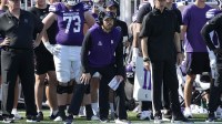 Northwestern Wildcats head coach David Braun (center) watches the game against the UCLA Bruins during the first half at Northwestern Medicine Field at Martin Stadium.