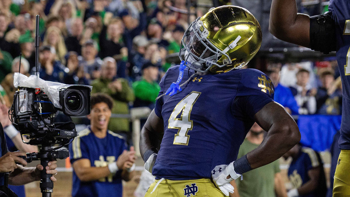 Notre Dame Fighting Irish running back Jeremiyah Love (4) celebrates his touchdown in the first half against the Southern California Trojans at Notre Dame Stadium.
