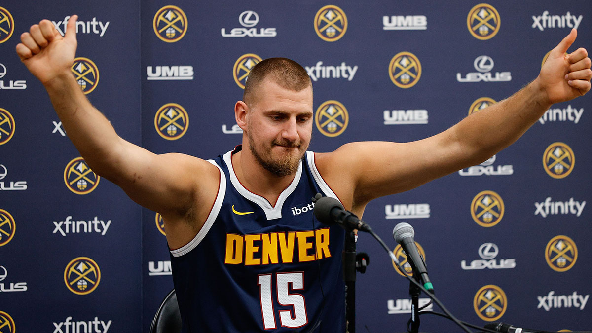 Nuggets player Nikola Jokic (15) takes questions during media day at Ball Arena