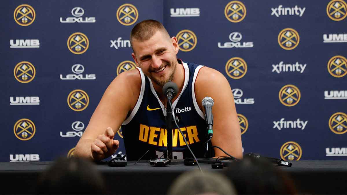 Nuggets player Nikola Jokic (15) takes questions