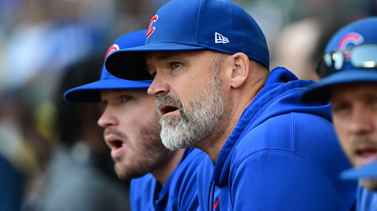 Chicago Cubs manager David Ross looks on from the dugout during game against the Milwaukee Brewers at American Family Field. Mandatory Credit: Benny Sieu-Imagn Images