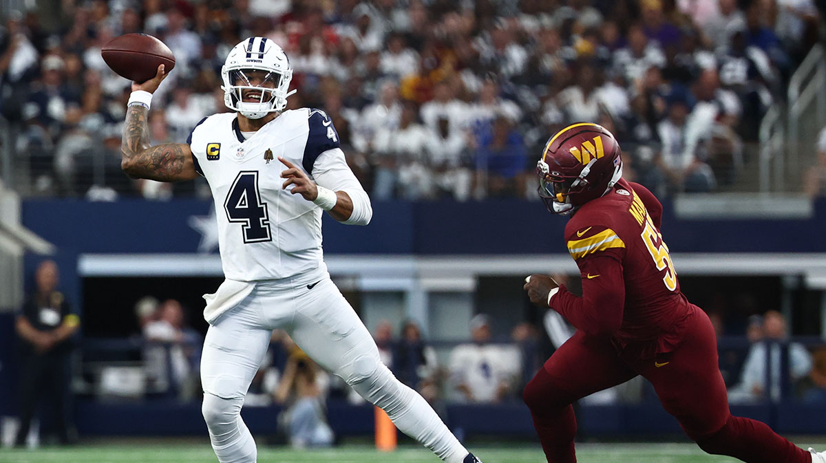 Dallas Cowboys quarterback Dak Prescott (4) scrambles against under pressures from Washington Commanders defensive end Jacob Martin (55) during the first quarter of the game at AT&T Stadium. Mandatory Credit: Kevin Jairaj-Imagn Images