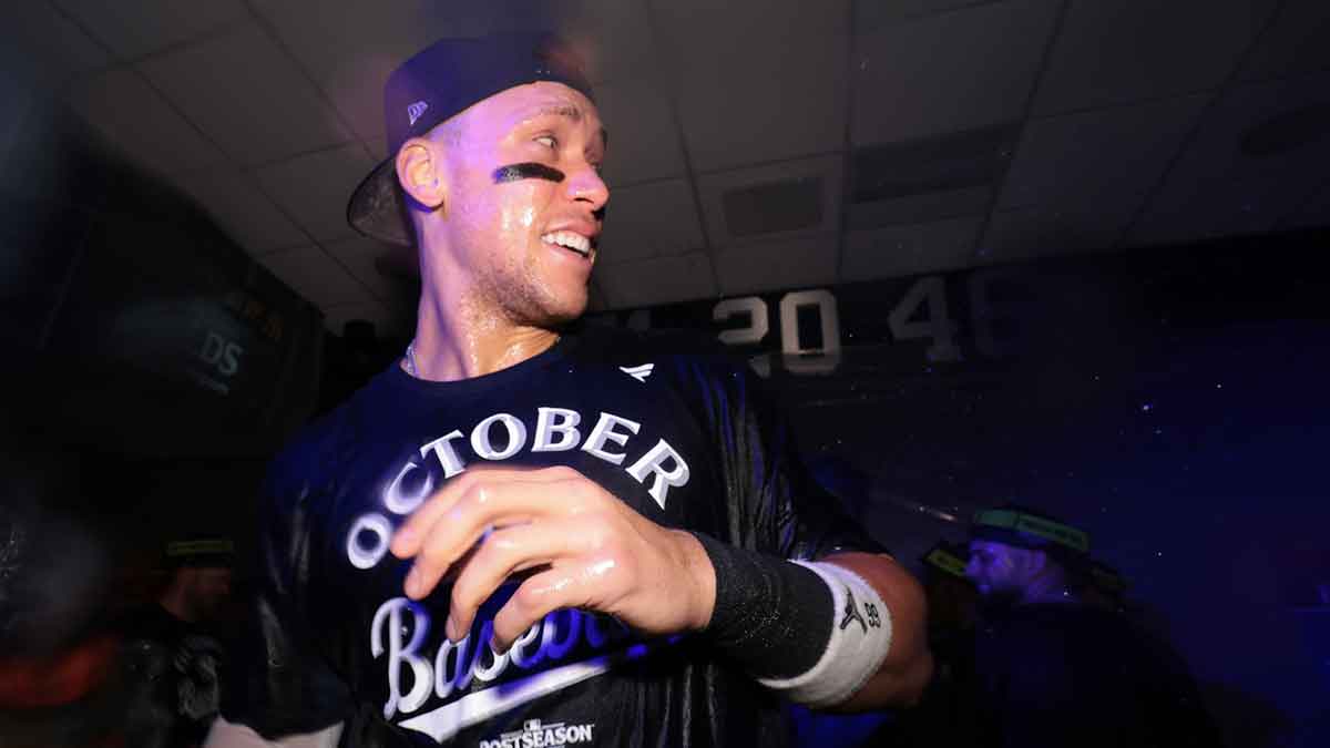 New York Yankees outfielder Aaron Judge (99) celebrates with teammates in the clubhouse after defeating the Boston Red Sox in game three of the Wildcard round of the 2025 MLB playoffs at Yankee Stadium. Mandatory Credit: Vincent Carchietta-Imagn Images