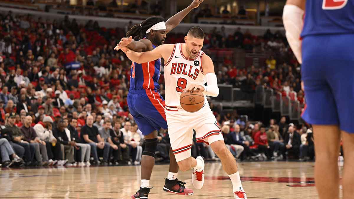 Oct 22, 2025; Chicago, Illinois, USA; Detroit Pistons forward Isaiah Stewart (28) fouls Chicago Bulls center Nikola Vucevic (9) during the first half at United Center. Mandatory Credit: Matt Marton-Imagn Images