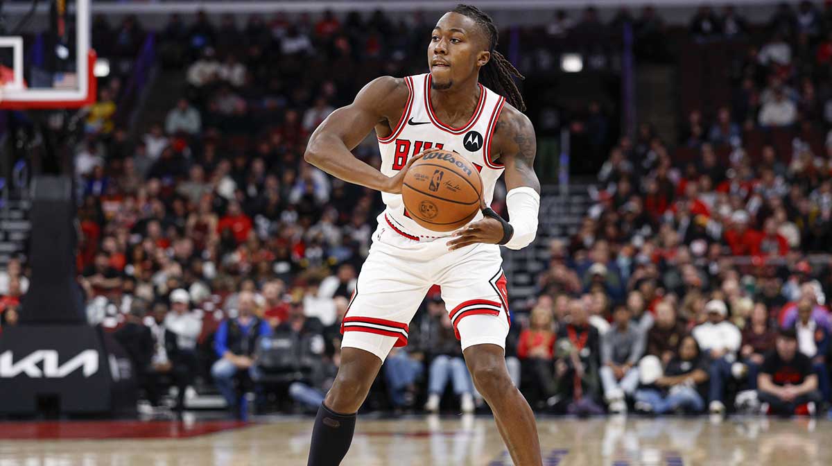 Oct 27, 2025; Chicago, Illinois, USA; Chicago Bulls guard Ayo Dosunmu (11) looks to pass the ball against the Atlanta Hawks during the first half at United Center. Mandatory Credit: Kamil Krzaczynski-Imagn Images