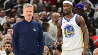 Golden State Warriors head coach Steve Kerr and forward Jimmy Butler (10) looks on during a timeout in the second quarter against the Milwaukee Bucks at Fiserv Forum. Mandatory Credit: Benny Sieu-Imagn Images