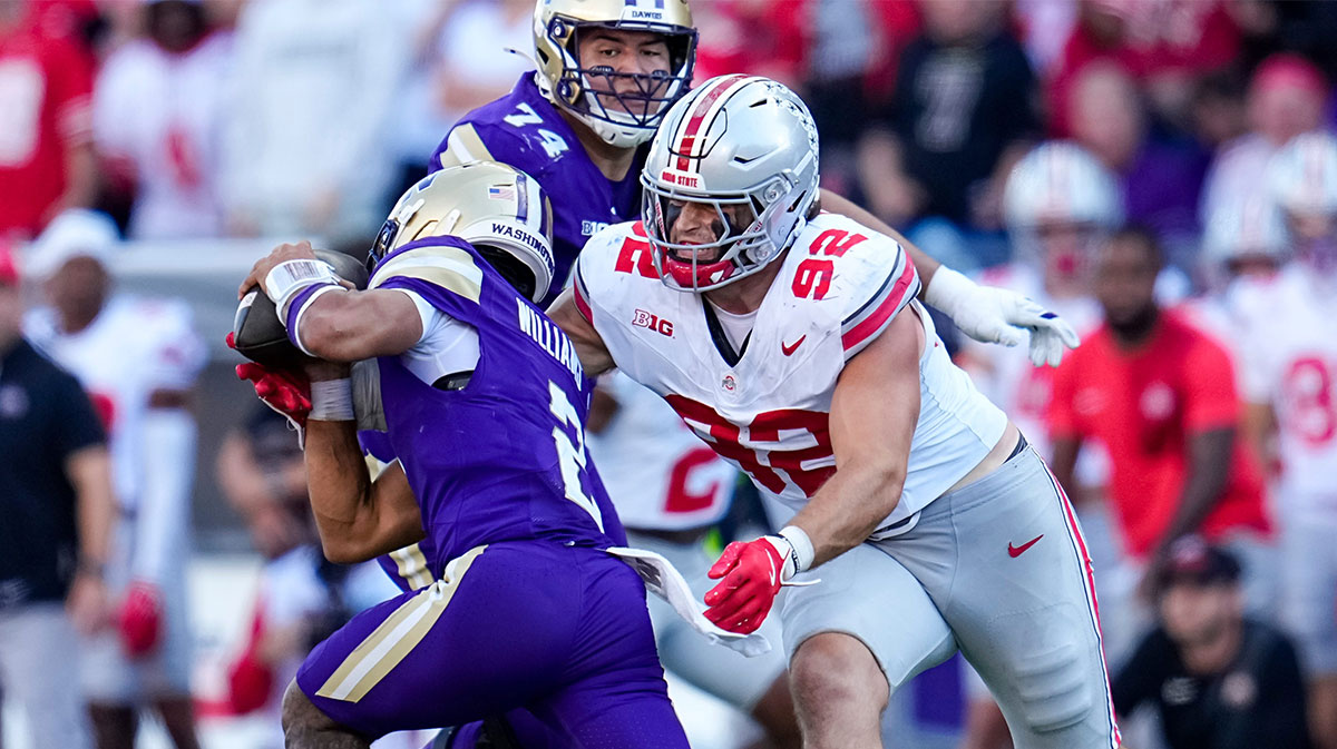 Ohio State Buckeyes defensive end Caden Curry (92) sacks Washington Huskies quarterback Demond Williams Jr. (2) during the second half of the NCAA football game at Husky Stadium in Seattle