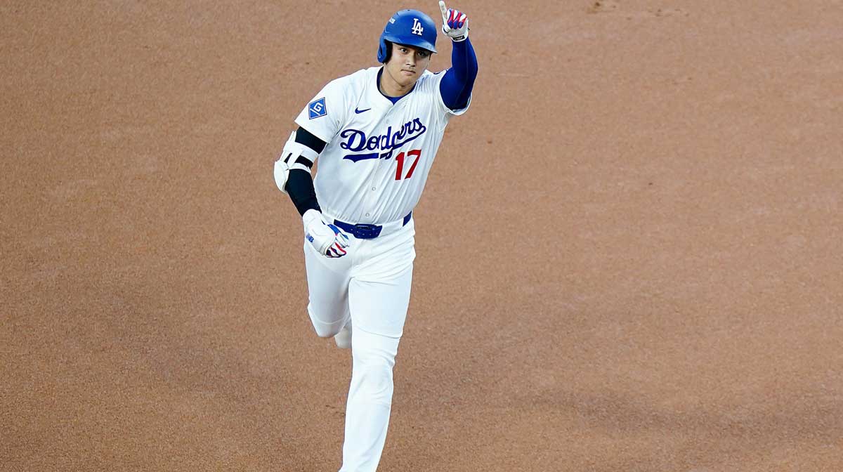 Los Angeles Dodgers designated hitter Shohei Ohtani (17) gestures towards fans after scoring a homer in the first inning of the MLB National League Wild Card Game 1 between the Cincinnati Reds and LA Dodgers, Tuesday, Sept. 30, 2025, at Dodger Stadium in Los Angeles, California.