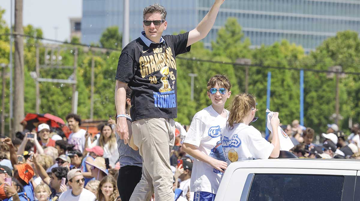 Oklahoma City mayor David Holt waves to fans along the Oklahoma City Thunder Champions parade route