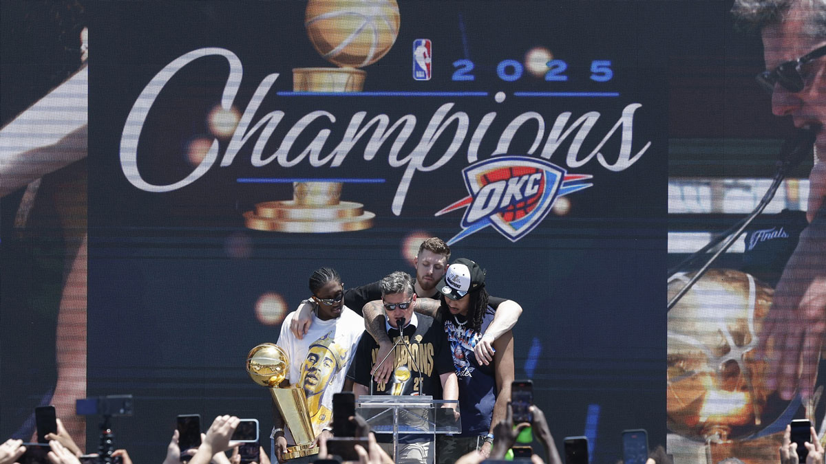 Thunder forward Jalen Williams, left, Oklahoma City Thunder center Isaiah Hartenstein, back, and Oklahoma City Thunder forward Jaylin Williams, right, gather around Oklahoma City Mayor David Holt during the Oklahoma City Thunder Champions parade closing ceremony at Scissortail Park