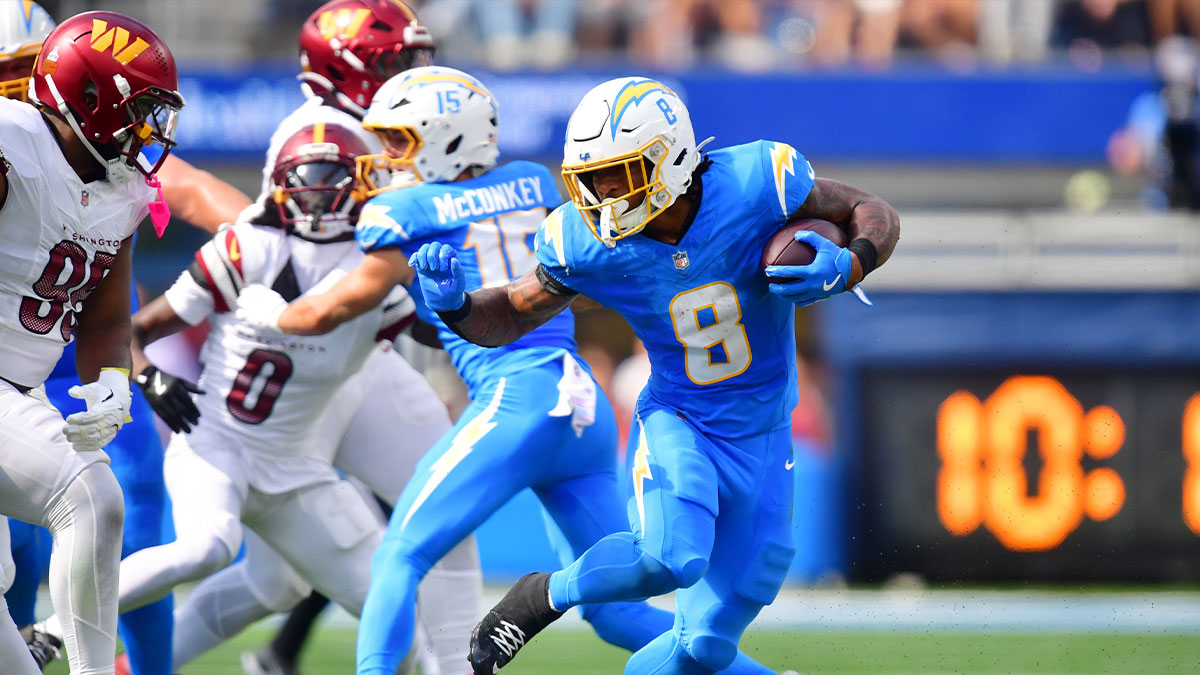 Los Angeles Chargers running back Omarion Hampton (8) runs against Washington Commanders defensive tackle Jer'Zhan Newton (95) in the first half at SoFi Stadium.
