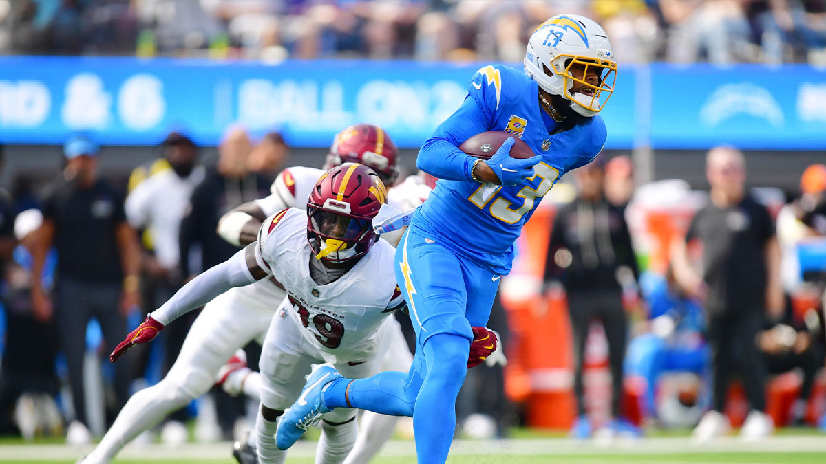  Los Angeles Chargers wide receiver Keenan Allen (13) runs against Washington Commanders safety Jeremy Reaves (39) in the first half at SoFi Stadium. 