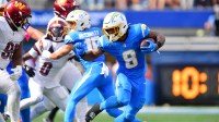 Los Angeles Chargers running back Omarion Hampton (8) runs against Washington Commanders defensive tackle Jer'Zhan Newton (95) in the first half at SoFi Stadium.