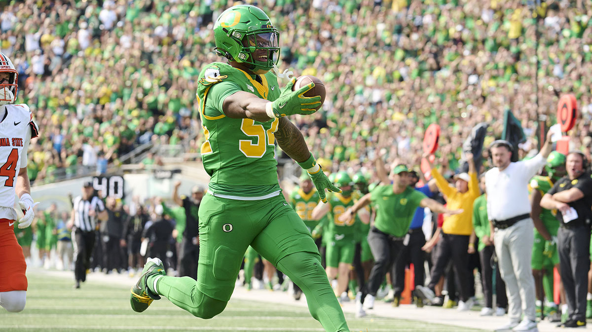 Oregon Ducks linebacker Jerry Mixon (54) celebrates after intercepting the football for a touchdown during the second half against the Oklahoma State Cowboys at Autzen Stadium.