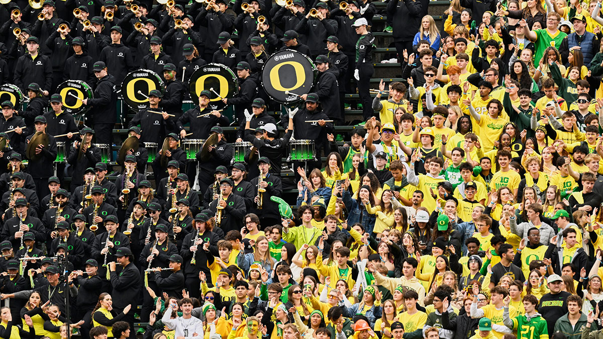 The Oregon marching band and fans in the Oregon student section cheer for their team against the Indiana Hoosiers during the second quarter at Autzen Stadium.