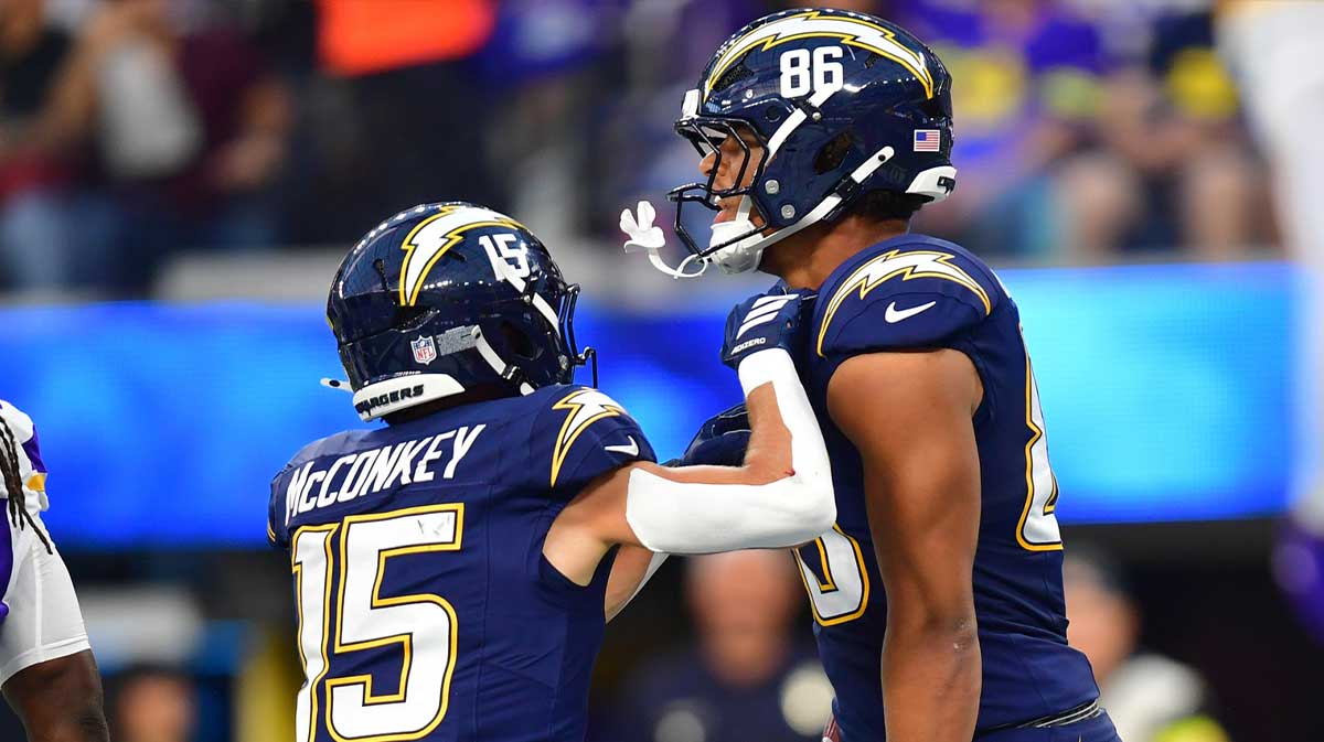 Oct 23, 2025; Inglewood, California, USA; Los Angeles Chargers tight end Oronde Gadsden II (86) reacts after scoring a touchdown with wide receiver Ladd McConkey (15) during the first half at SoFi Stadium. Mandatory Credit: Gary A. Vasquez-Imagn Images