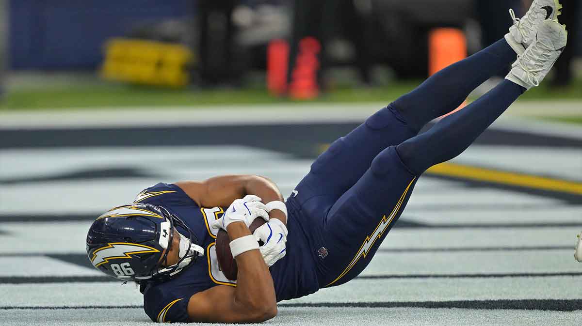 Los Angeles Chargers tight end Oronde Gadsden II (86) catches a touchdown pass against the Minnesota Vikings during the first half at SoFi Stadium.