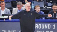 Pacers head coach Rick Carlisle reacts after a play against the Oklahoma City Thunder during the second half of game seven of the 2025 NBA Finals at Paycom Center with the Thunder logo in the background