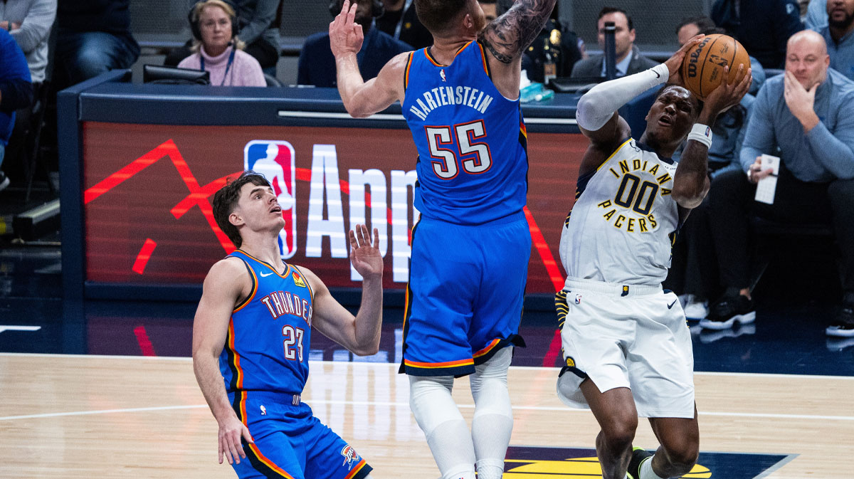 Indiana Pacers guard Bennedict Mathurin (00) shoots the ball while Oklahoma City Thunder center Isaiah Hartenstein (55) defends in the first half at Gainbridge Fieldhouse.