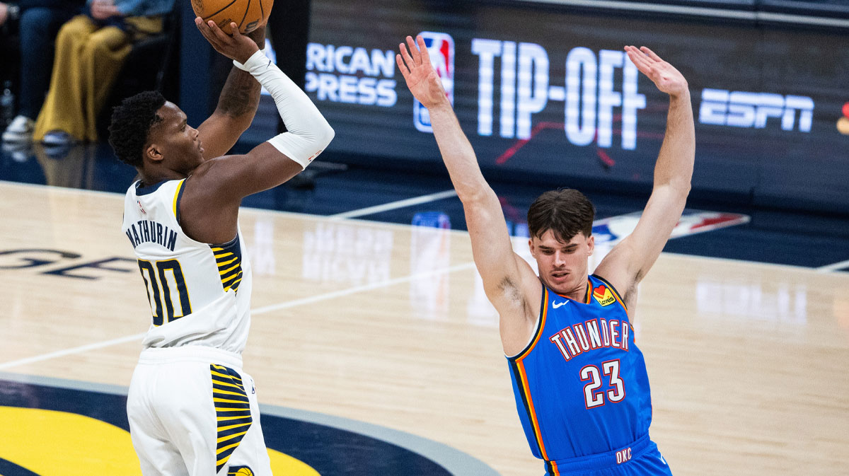 Indiana Pacers guard Bennedict Mathurin (00) shoots the ball while Oklahoma City Thunder forward Brooks Barnhizer (23) defends in the first half at Gainbridge Fieldhouse.